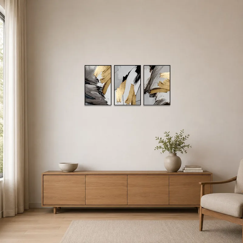 The minimalist room features the triptych, adding a chic aesthetic to the simple decor.