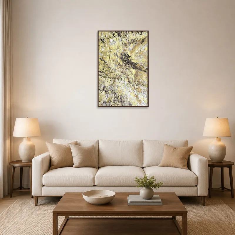 Abstract gold and gray print adds elegance to a living room above a modern sofa.