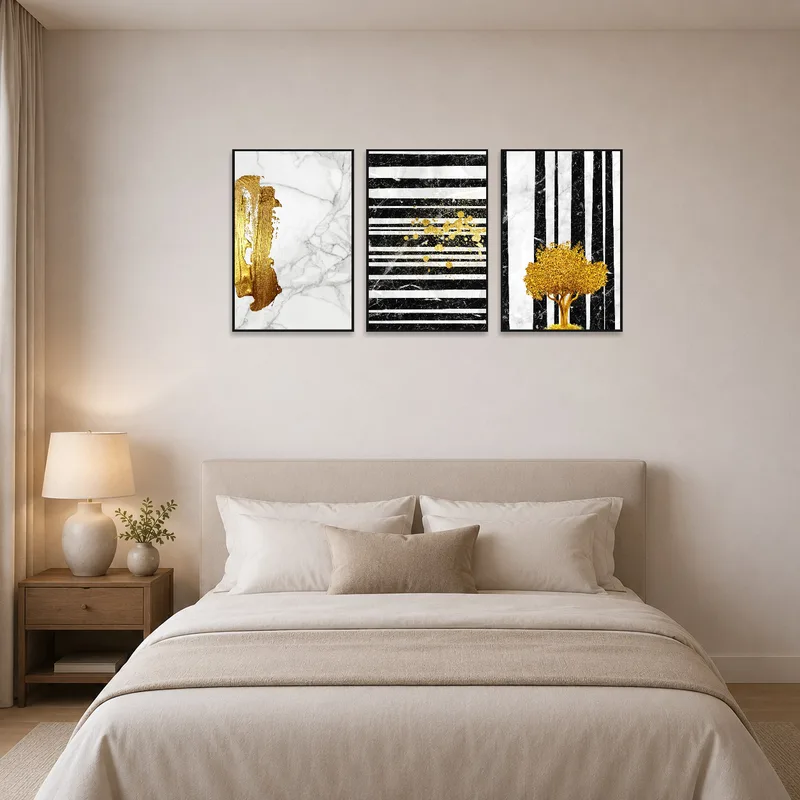 Three-panel gold and marble artwork enhances a serene bedroom setting.