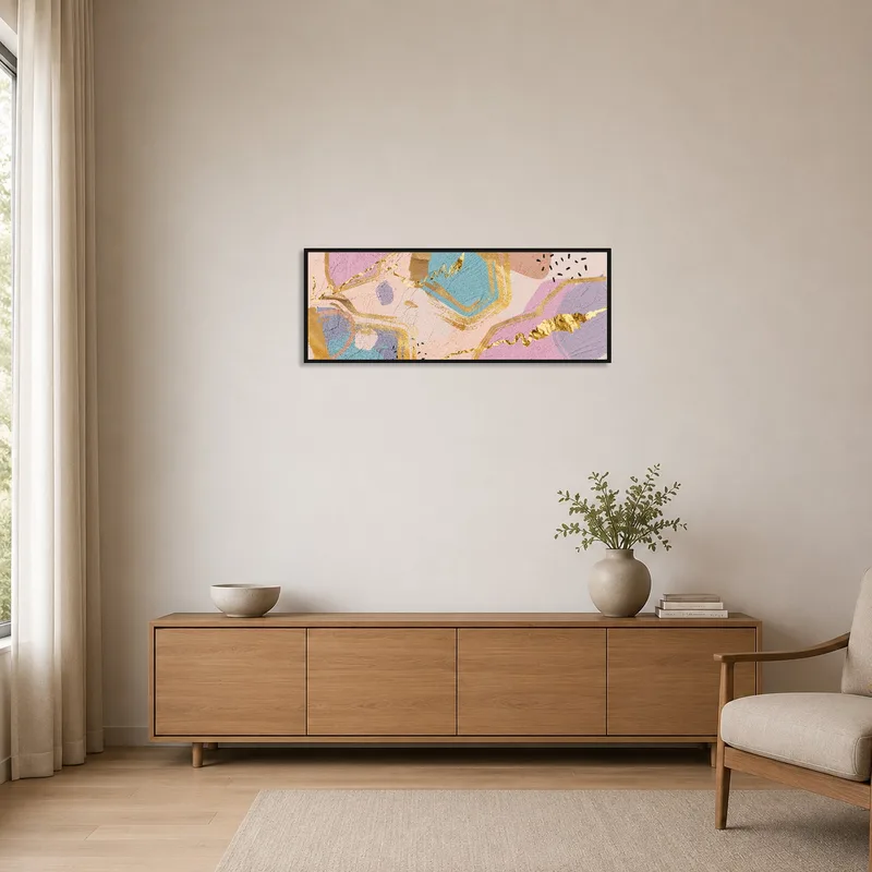 Gold and pastel geometric art print in a minimalist room with clean lines and white walls.