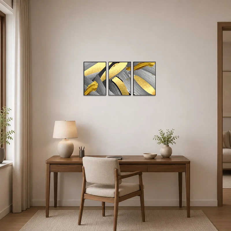 Modern abstract triptych featuring gold and silver brushstrokes energizes a productive home office.