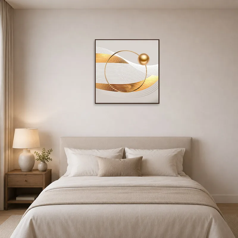 Gold and white geometric art enhancing the serene atmosphere of a bedroom.