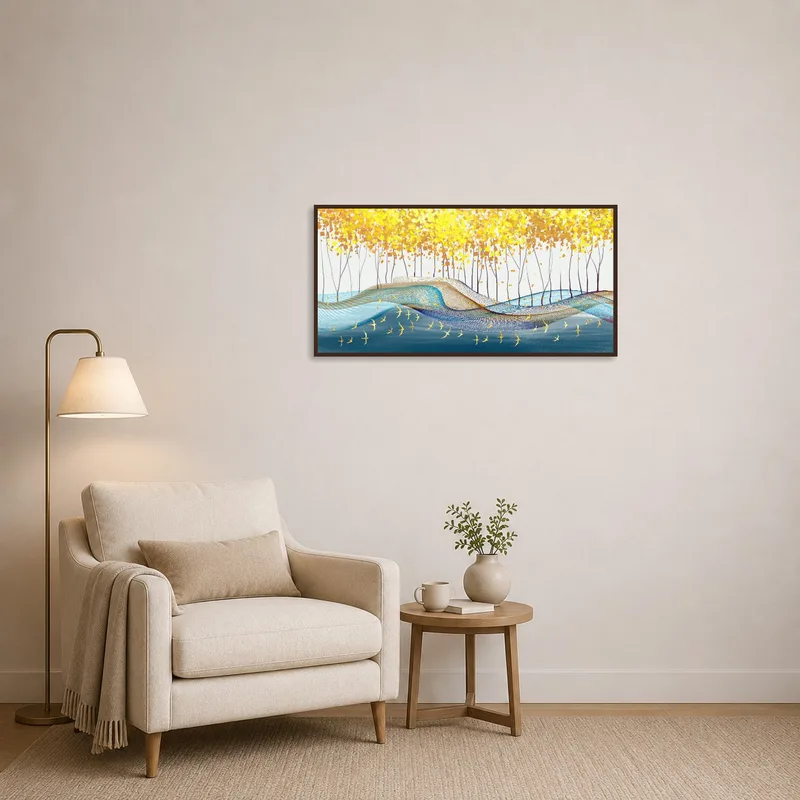 Cozy reading corner enhanced by abstract gold leaf waves art.