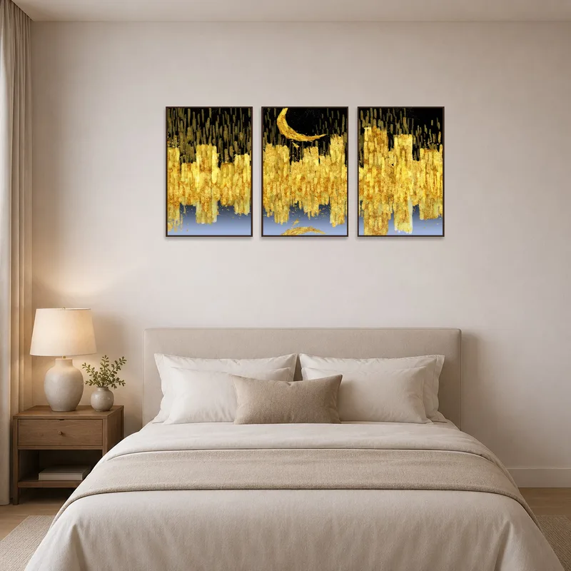 Abstract golden and black triptych art adds sophistication to a serene bedroom.