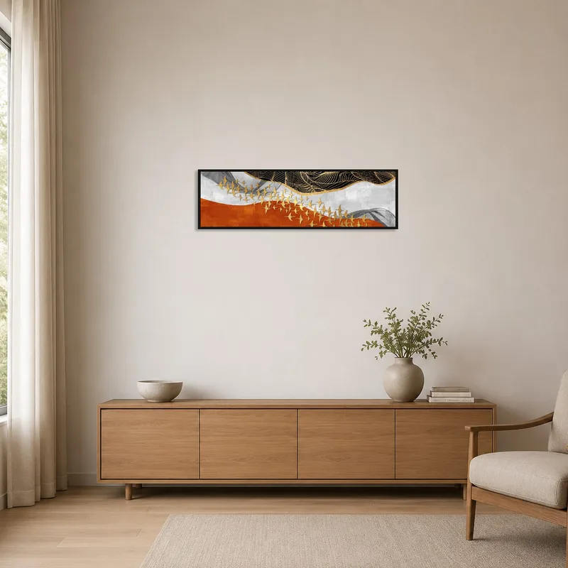 Minimalist space featuring abstract golden birds wall art against a neutral wall.