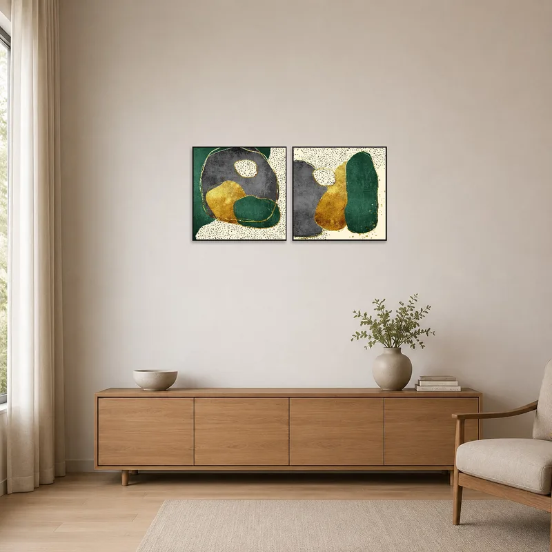 Minimalist room showcasing abstract green and gold art set on a plain background.