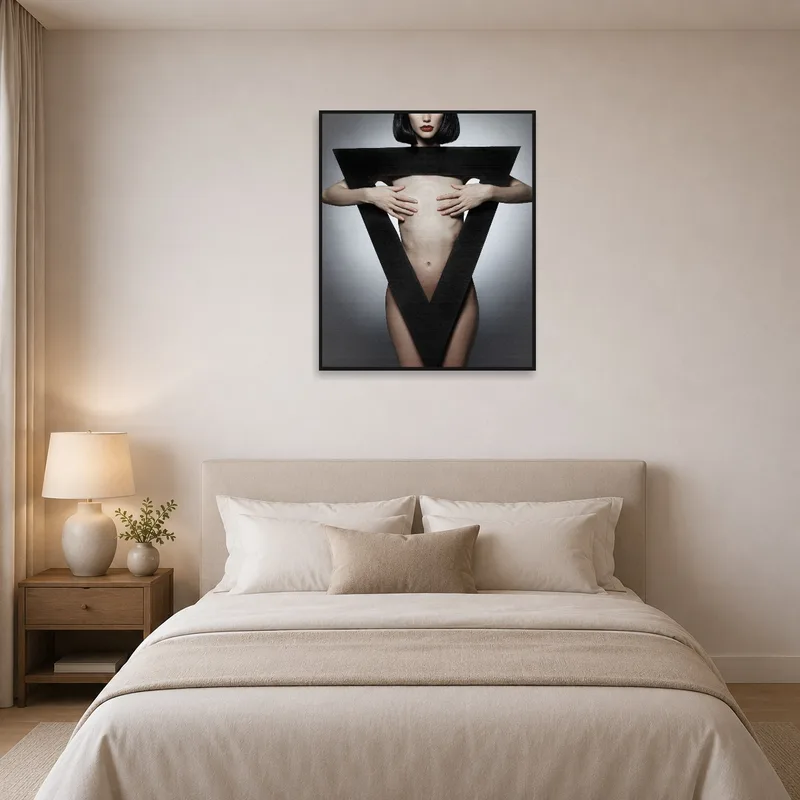 Bedroom adorned with wall art depicting abstract human form with geometric shapes.