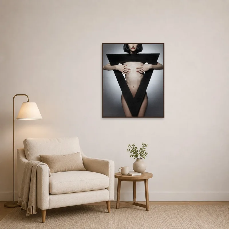 Reading corner decorated with abstract human form featuring geometric shape wall art.