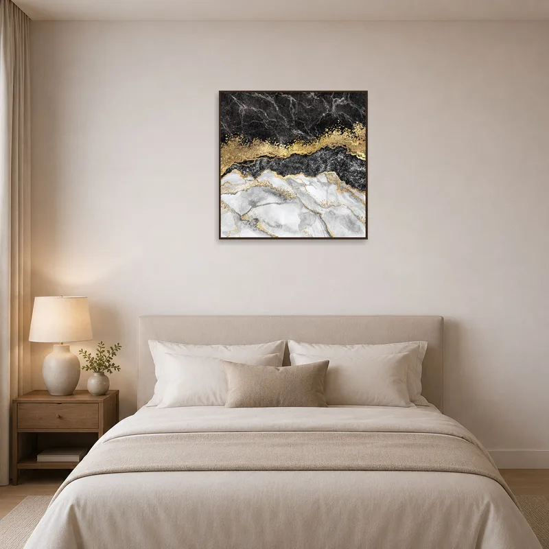 Bedroom displaying an art print of marble with gold in abstract form.