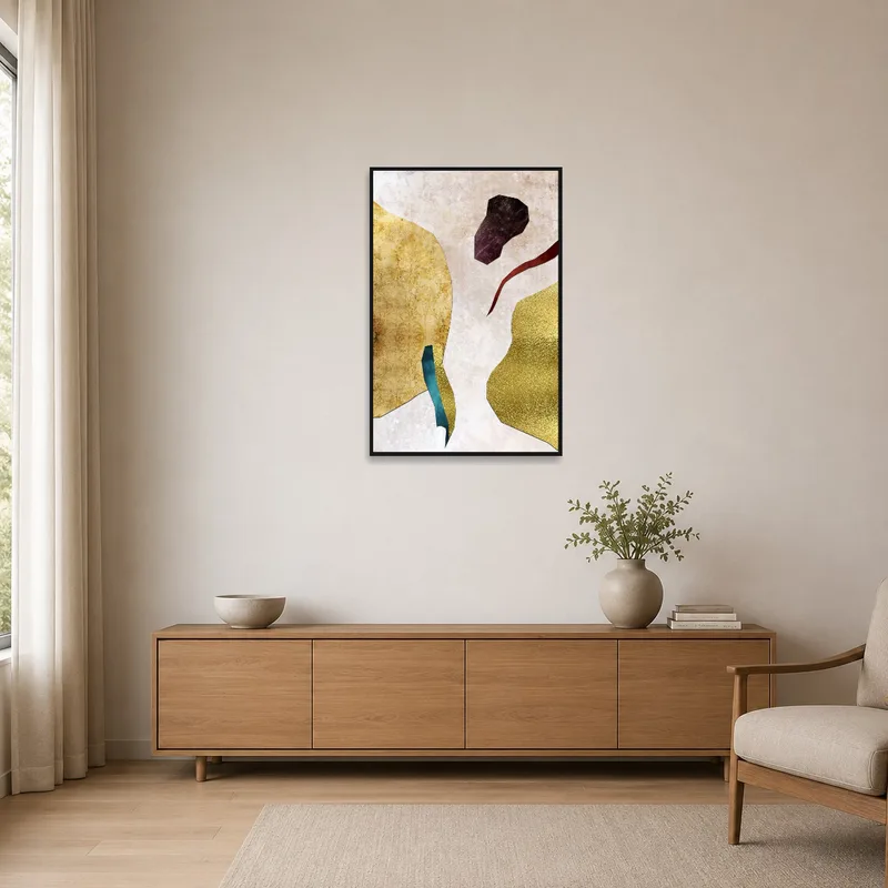 Abstract metallic collage in earthy tones in a minimalist room with sparse furnishings.