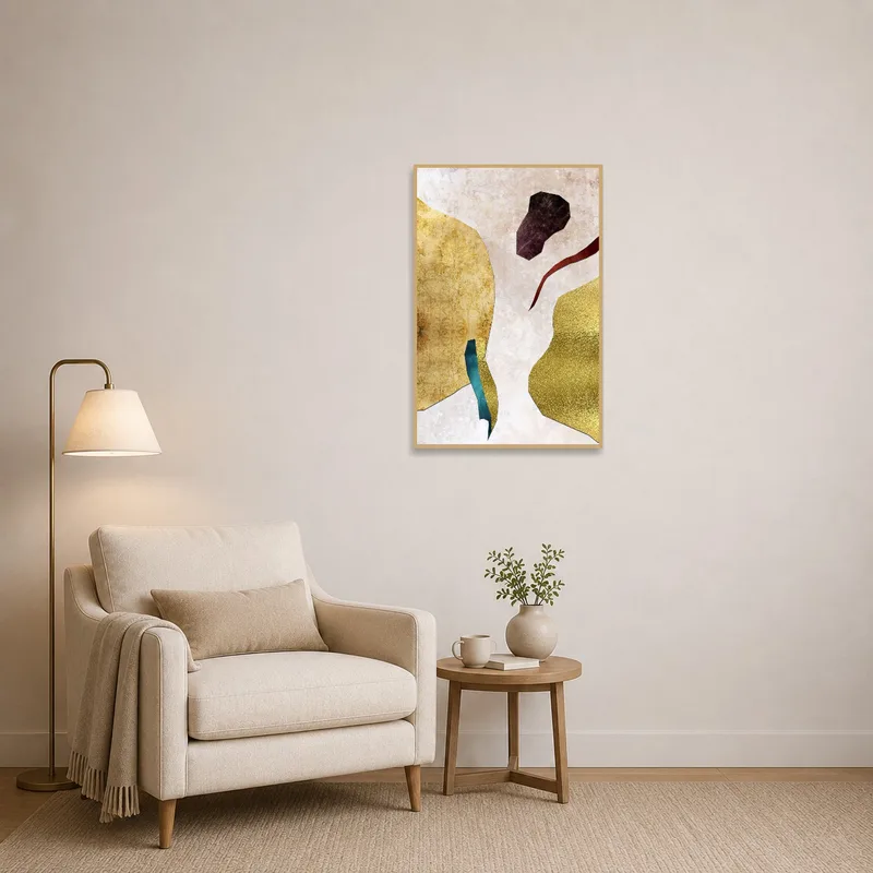 Abstract metallic collage in earthy tones enhancing a reading corner with a comfy armchair and books.
