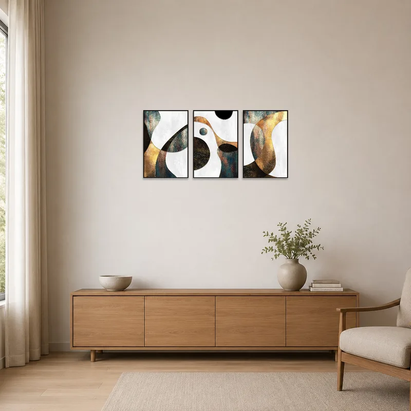 Modern abstract geometric triptych with metallic accents in a minimalist room setting.