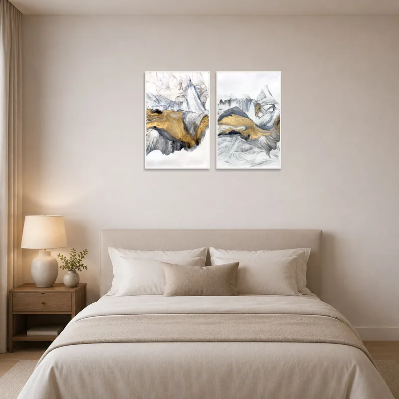 Elegant bedroom with abstract black, white, and gold art set above the headboard.