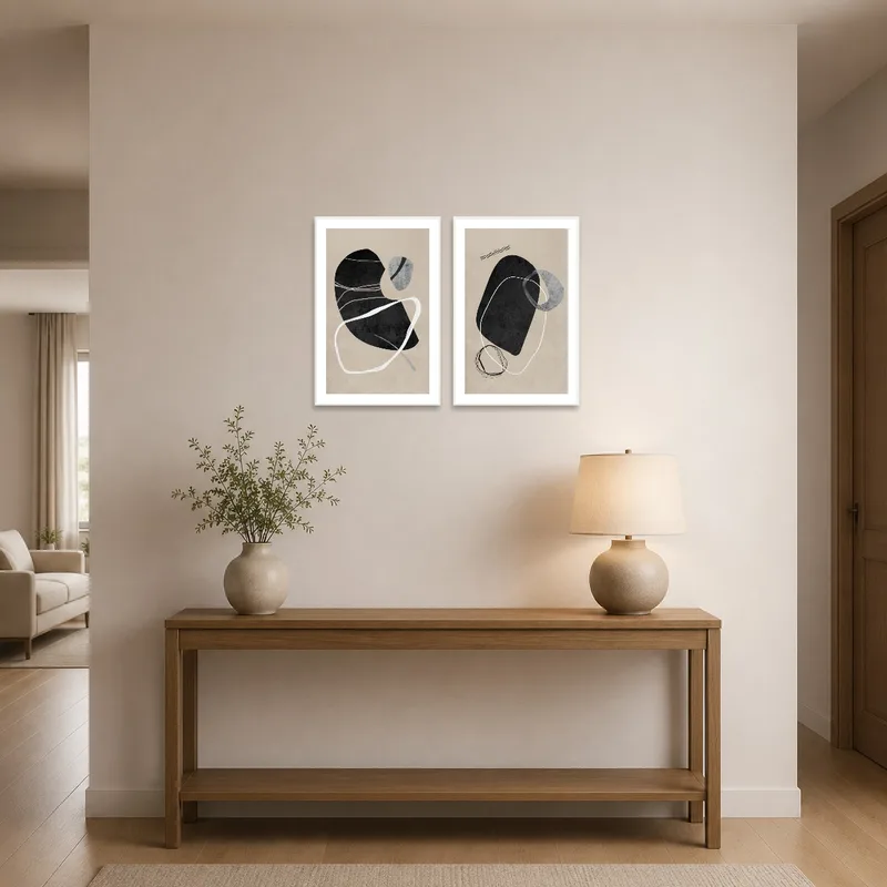 Abstract black and white forms greet guests in a stylish entrance hall.