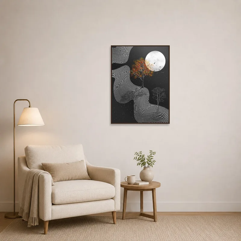 Reading corner featuring abstract moonlit landscape art behind a comfy chair.