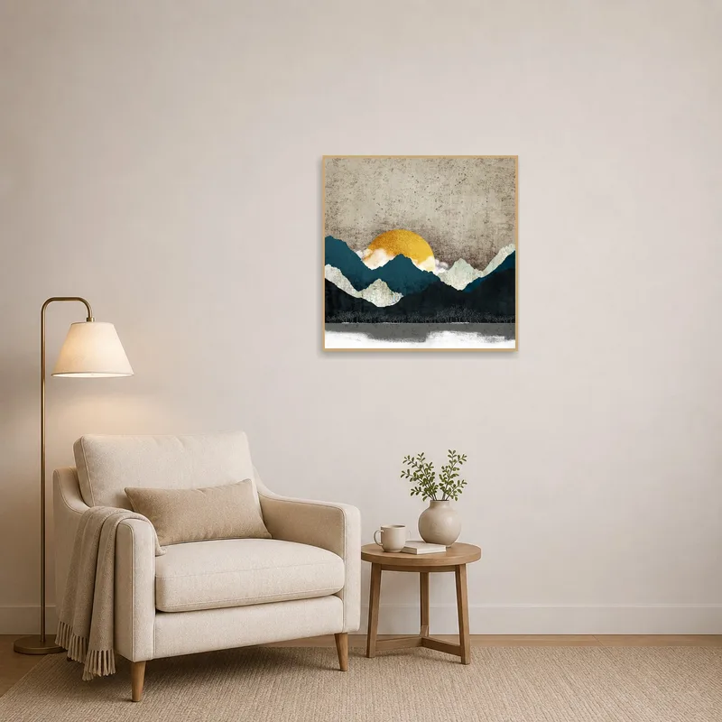 Abstract mountain landscape brightens a cozy reading corner with sunrise hues.