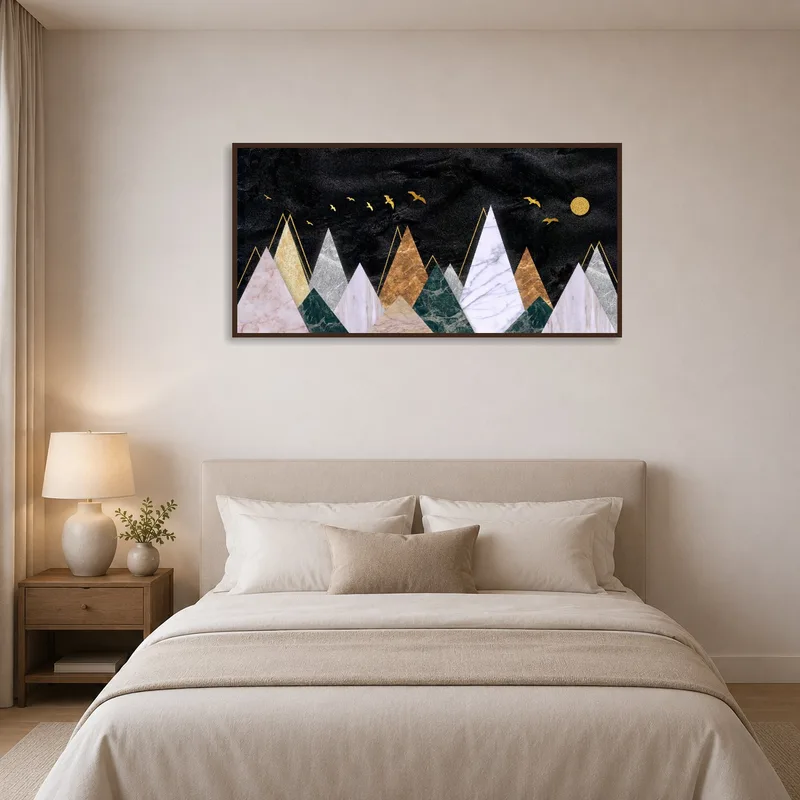 Serene bedroom with abstract mountain range and golden birds print above the headboard.