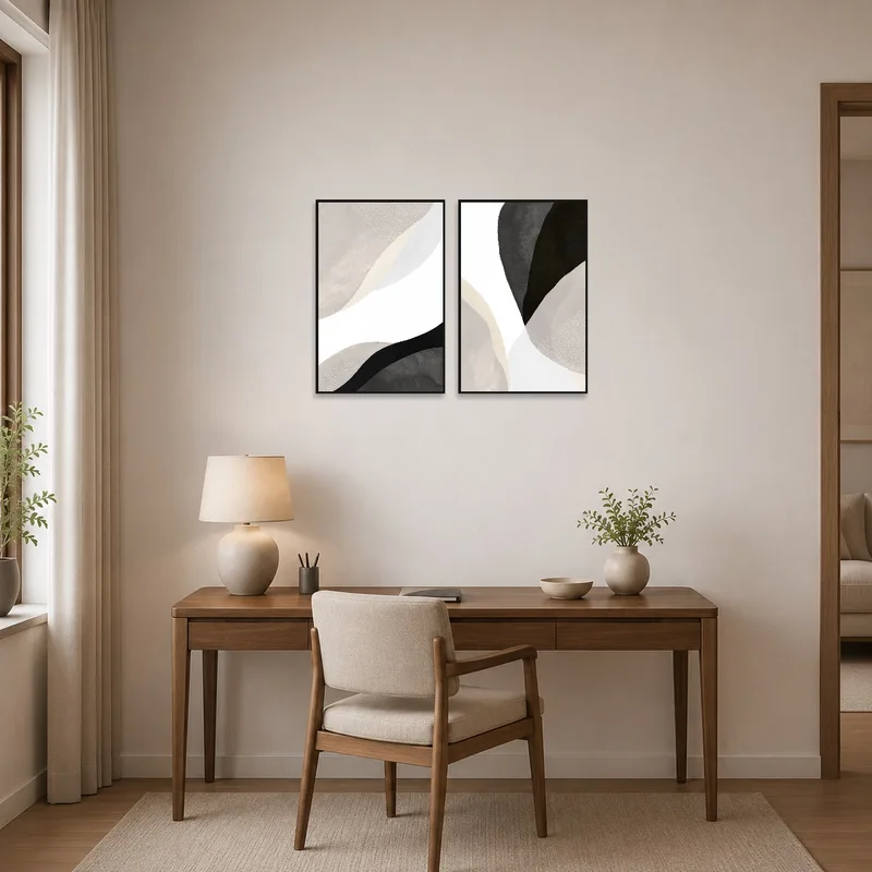 Neutral abstract art prints displayed in a home office.