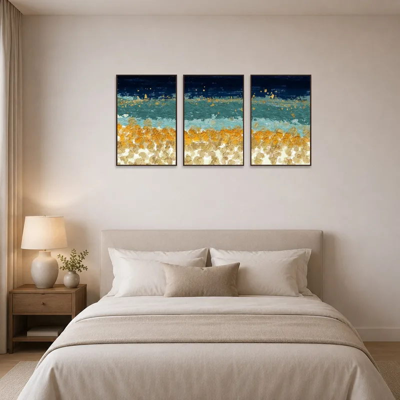 Bedroom featuring a calming ocean-inspired triptych with shimmering gold.
