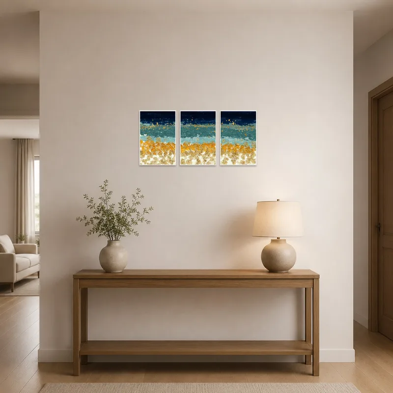 Entrance hall displaying a gold-accented abstract ocean triptych.