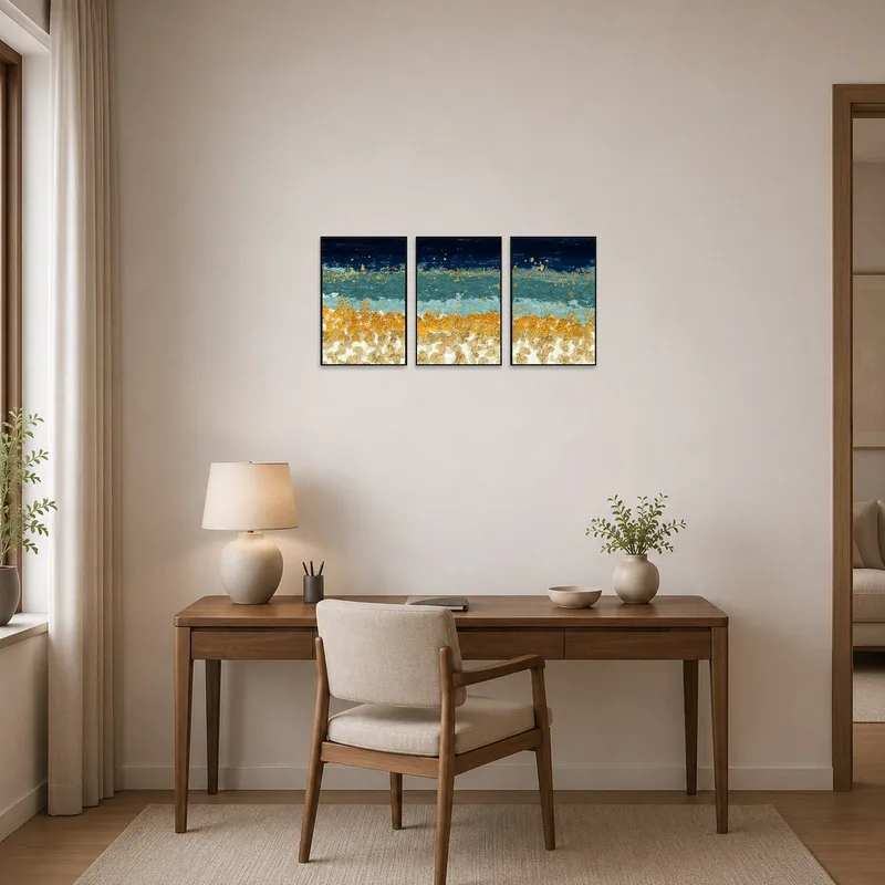 Home office adorned with an abstract ocean triptych featuring gold highlights.