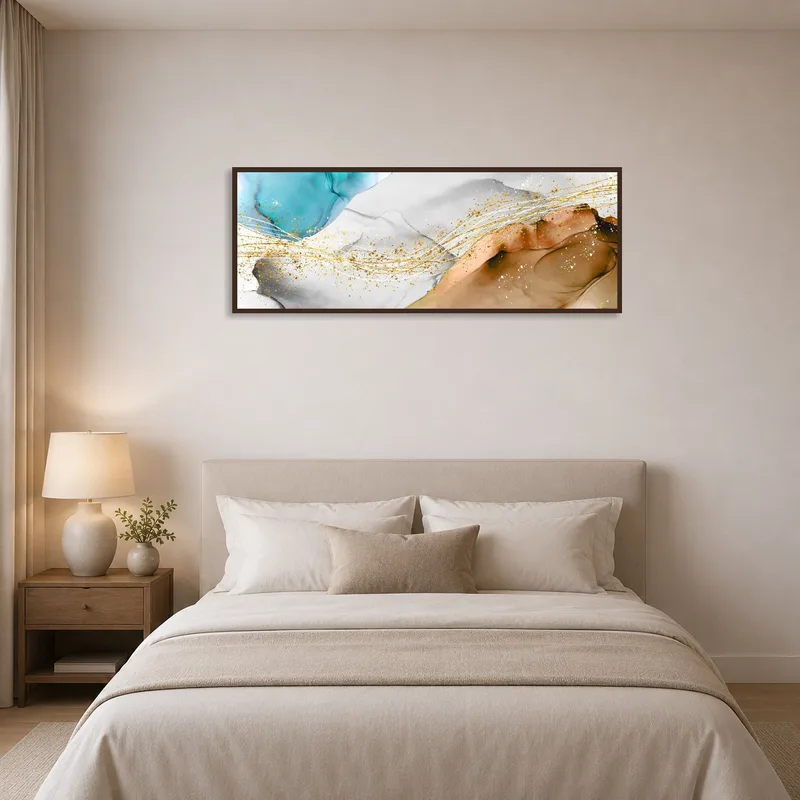 Bedroom scene with abstract panoramic art with gold accents above a sleek headboard.