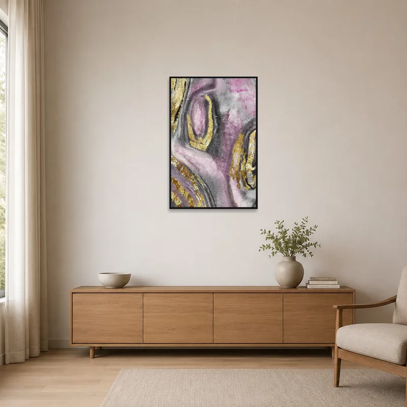 Abstract pink and gold art complements a minimalist space.