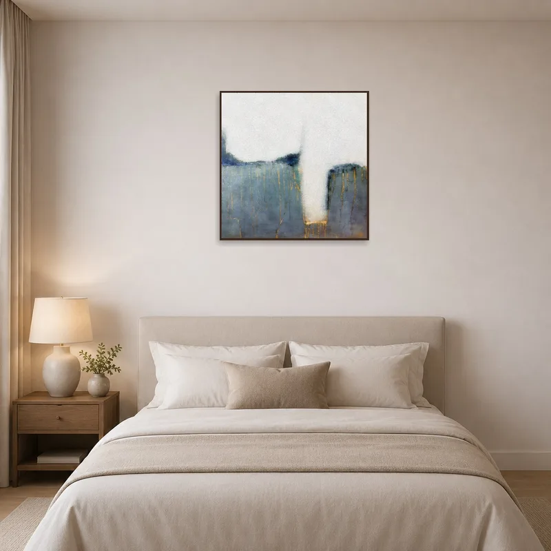 Calming blue and gold abstract piece on display in a tranquil bedroom.