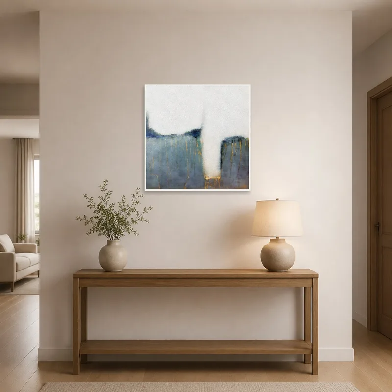 Artwork featuring abstract blue and gold design displayed in an entrance hall.