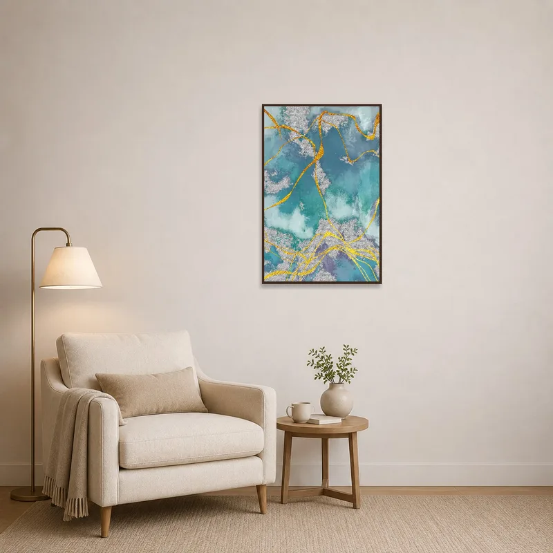 Cozy reading corner with teal and gold textured art hanging on the wall.