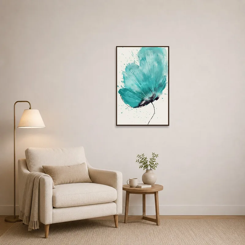 Cozy reading corner with a teal blossom art print on the wall.