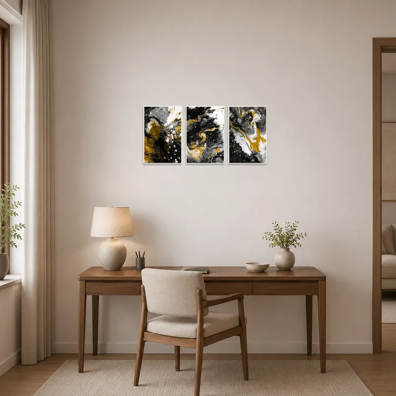 Home office with abstract triptych in gold, black, and white providing a focal point.