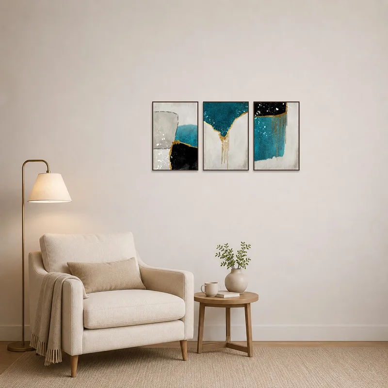 Cozy reading corner featuring an abstract triptych with gold accents and teal tones.