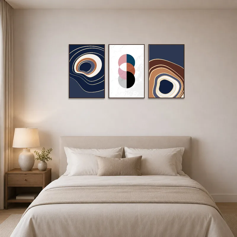 Abstract Waves and Circles pieces enhance the tranquility of a serene bedroom with muted colors.