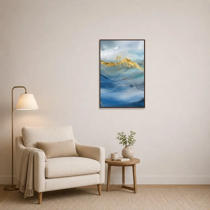 Gold-accented abstract wave art print brightening a cozy reading corner.
