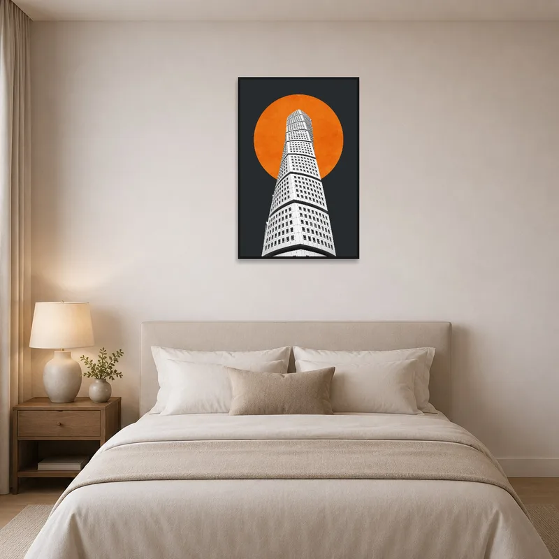 Bedroom with art showing an architectural tower beneath an orange sun on the wall.