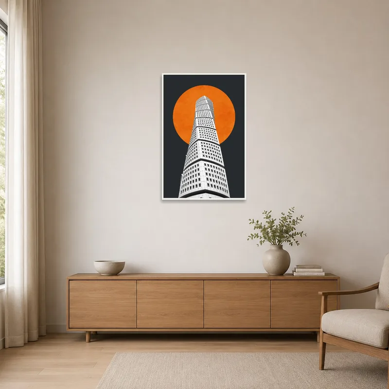 A minimalist room showcasing an artwork of an architectural tower and an orange sun.