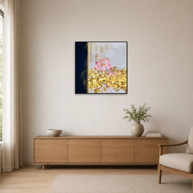 Square lotus print with subtle golden highlights on a crisp white wall in a minimalist setting.