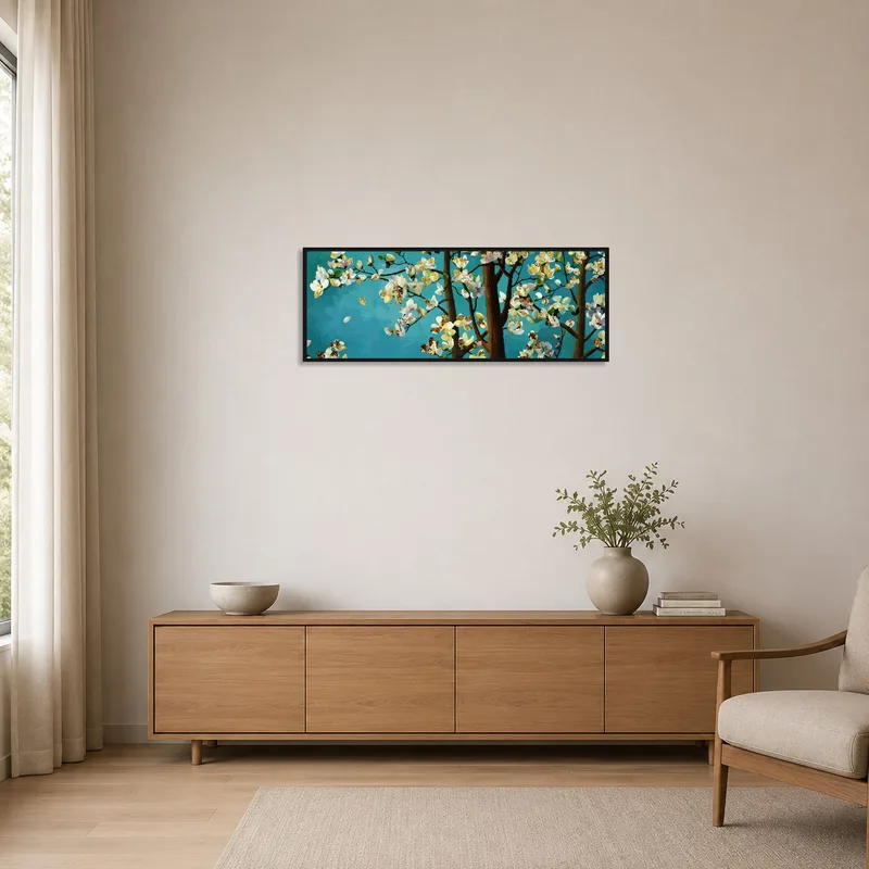Blossoming tree branches on turquoise bring a serene touch to a minimalist space.