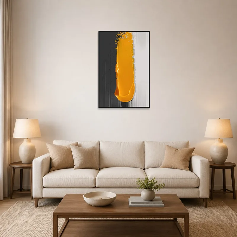Bold abstract art with mustard and grey colors on a living room wall.