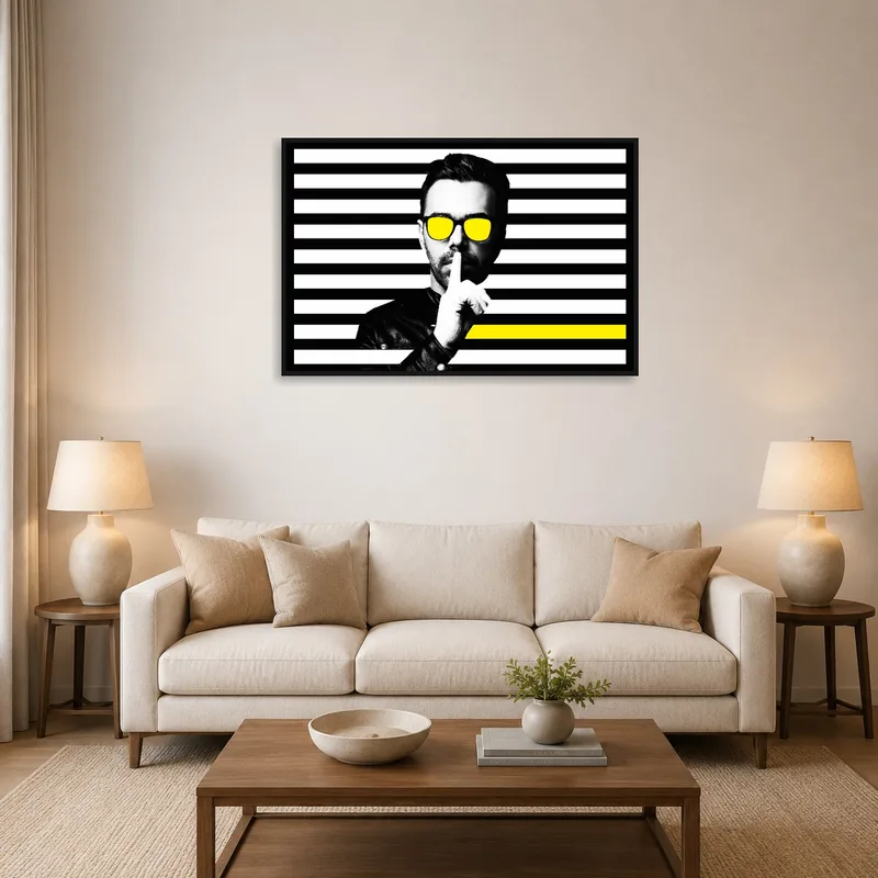 Modern art with yellow accents above a sofa in a contemporary living room.