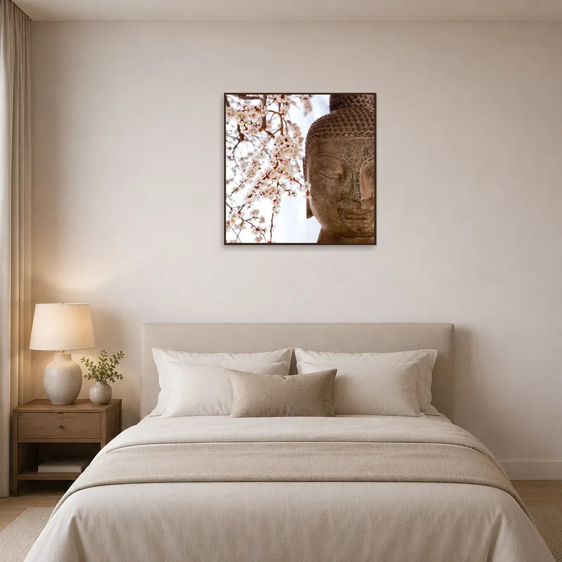 A calming Buddha art print brings peace to a bedroom setting.