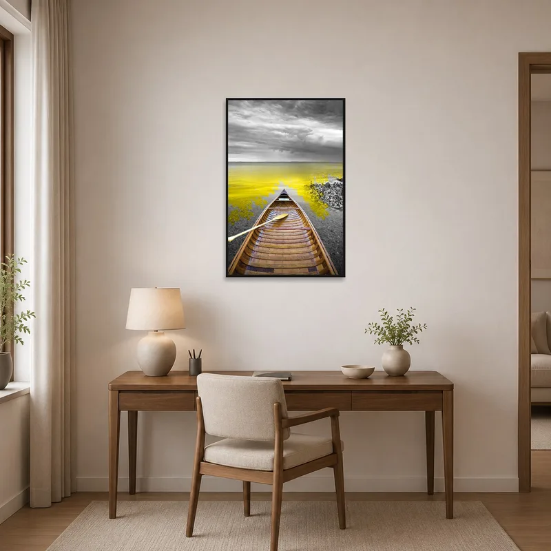 Home office displaying an art piece of a canoe under a moody sky on a yellow lake.
