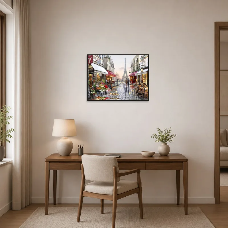 Home office displaying artwork of a Paris street and Eiffel Tower view.
