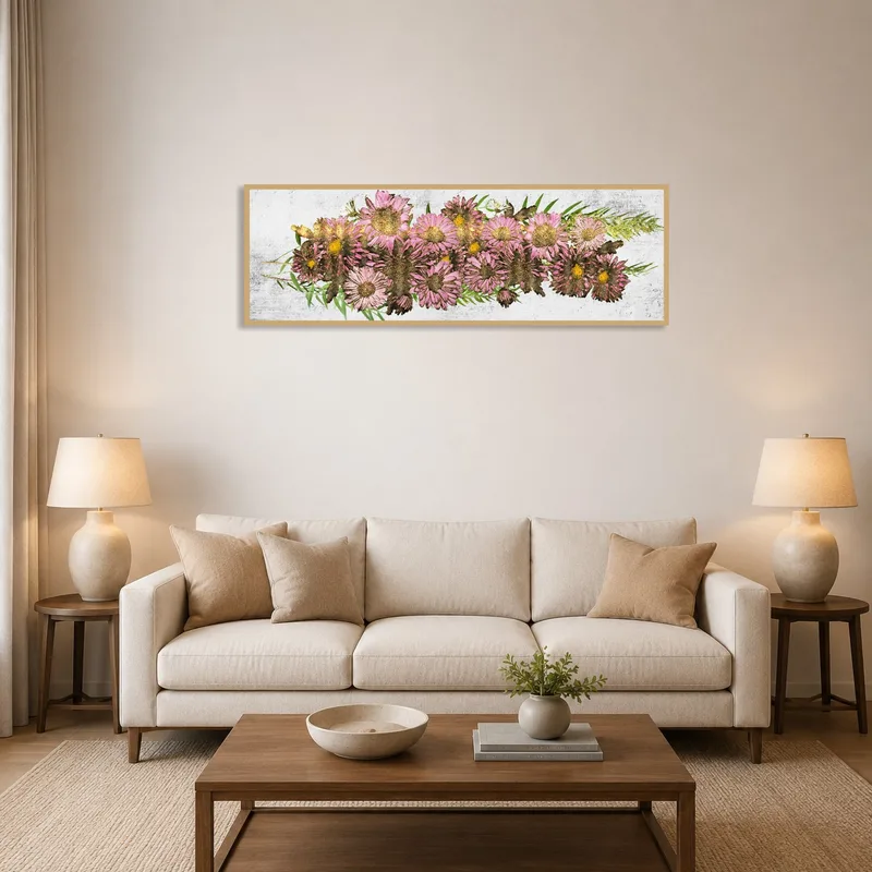Charming pink floral art print above a modern living room sofa.