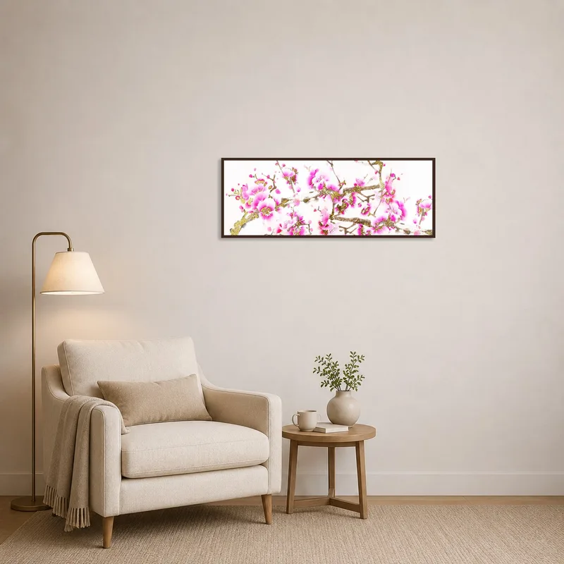 Cherry blossom artwork with gold touches next to a cozy reading corner.
