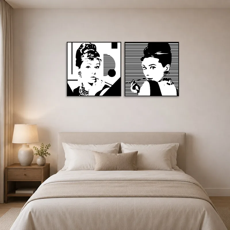 Bedroom wall featuring elegant black and white fashion prints.
