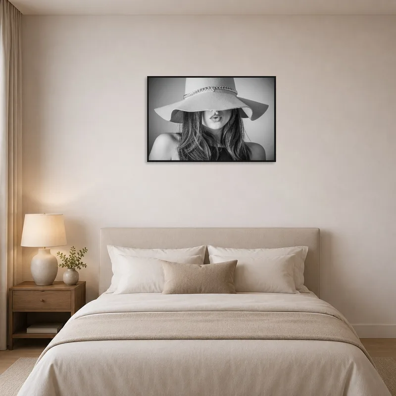The bedroom wall features a monochrome depiction of a woman in a hat, adding elegance.