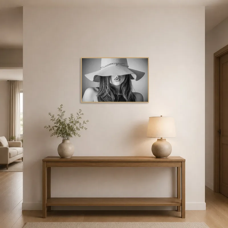 A striking monochrome woman in a hat greets visitors in the entrance hall.