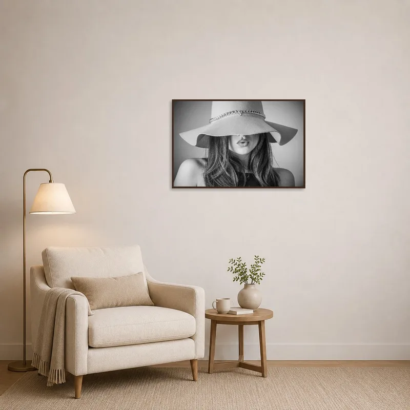 A monochrome portrait of a woman in a hat creates a focal point in the cozy reading corner.